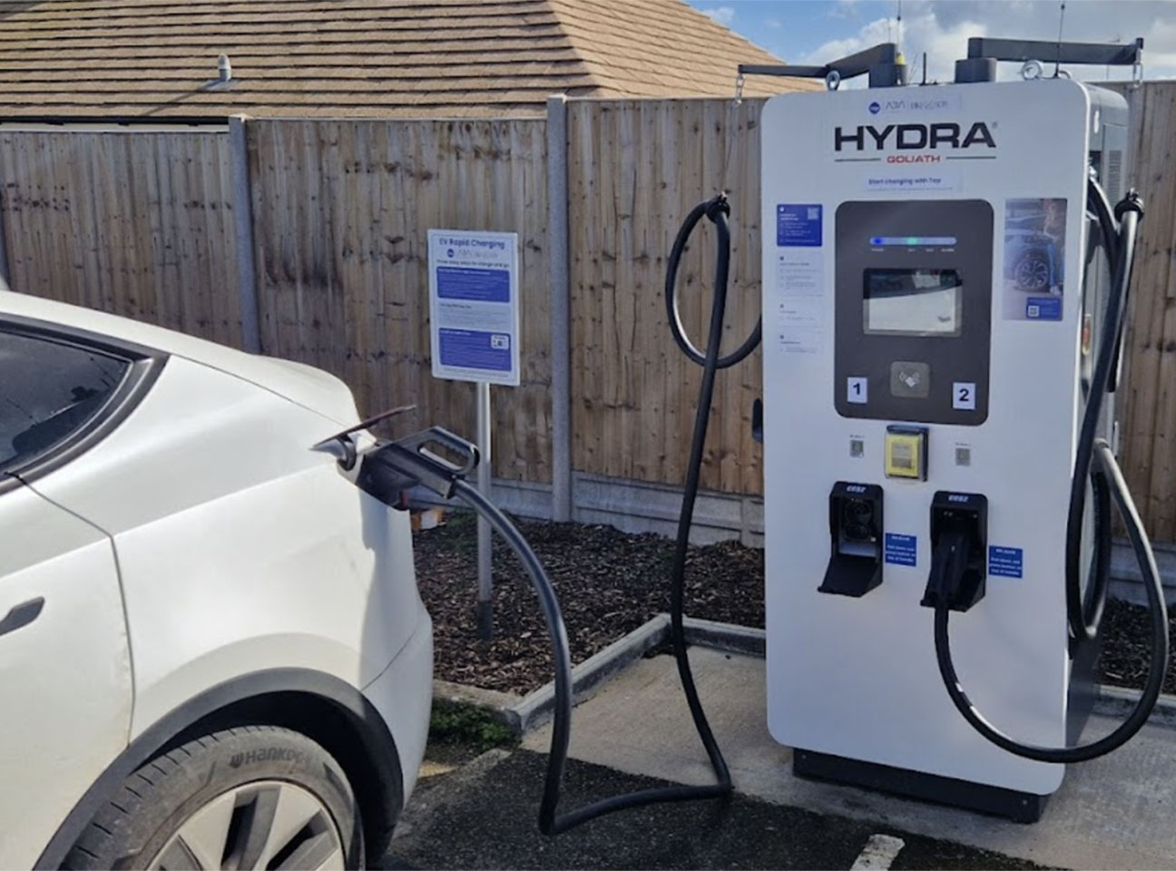 Electric Vehicle being charged in car park
