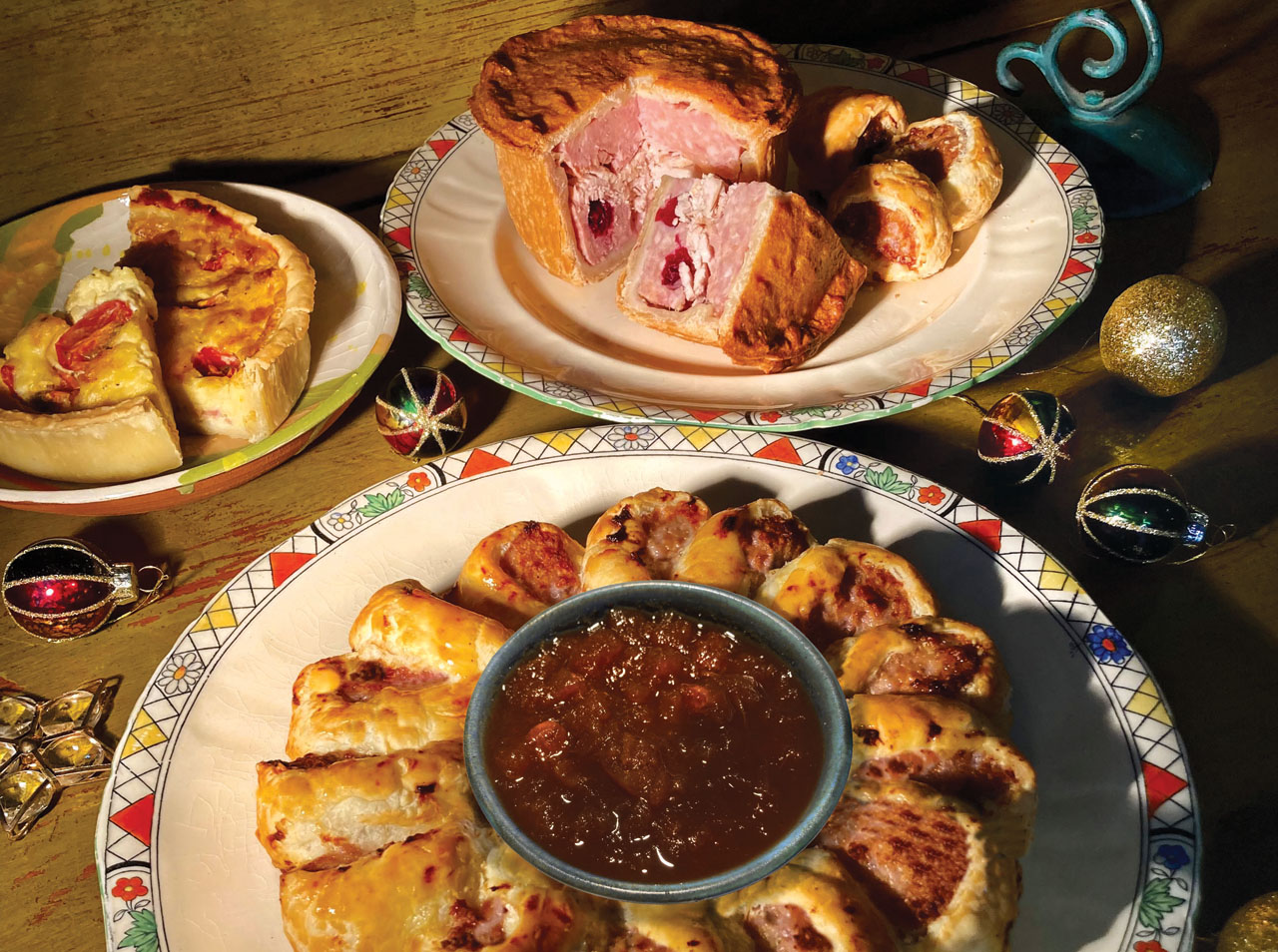 Home-made quiches, pies and a sausage roll wreath with apple and cider chutney
